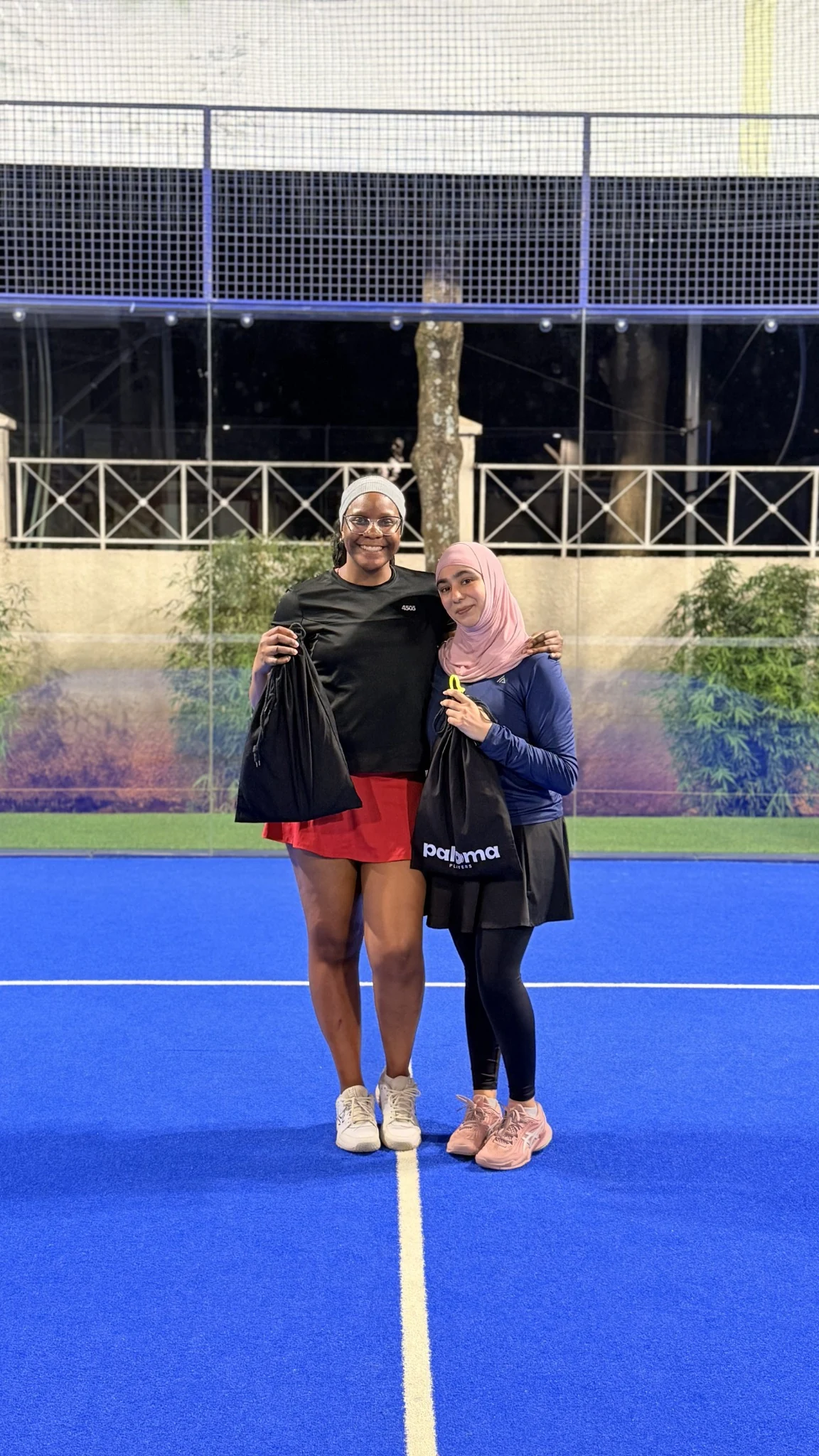 Tonia sharing a moment on court with another player.