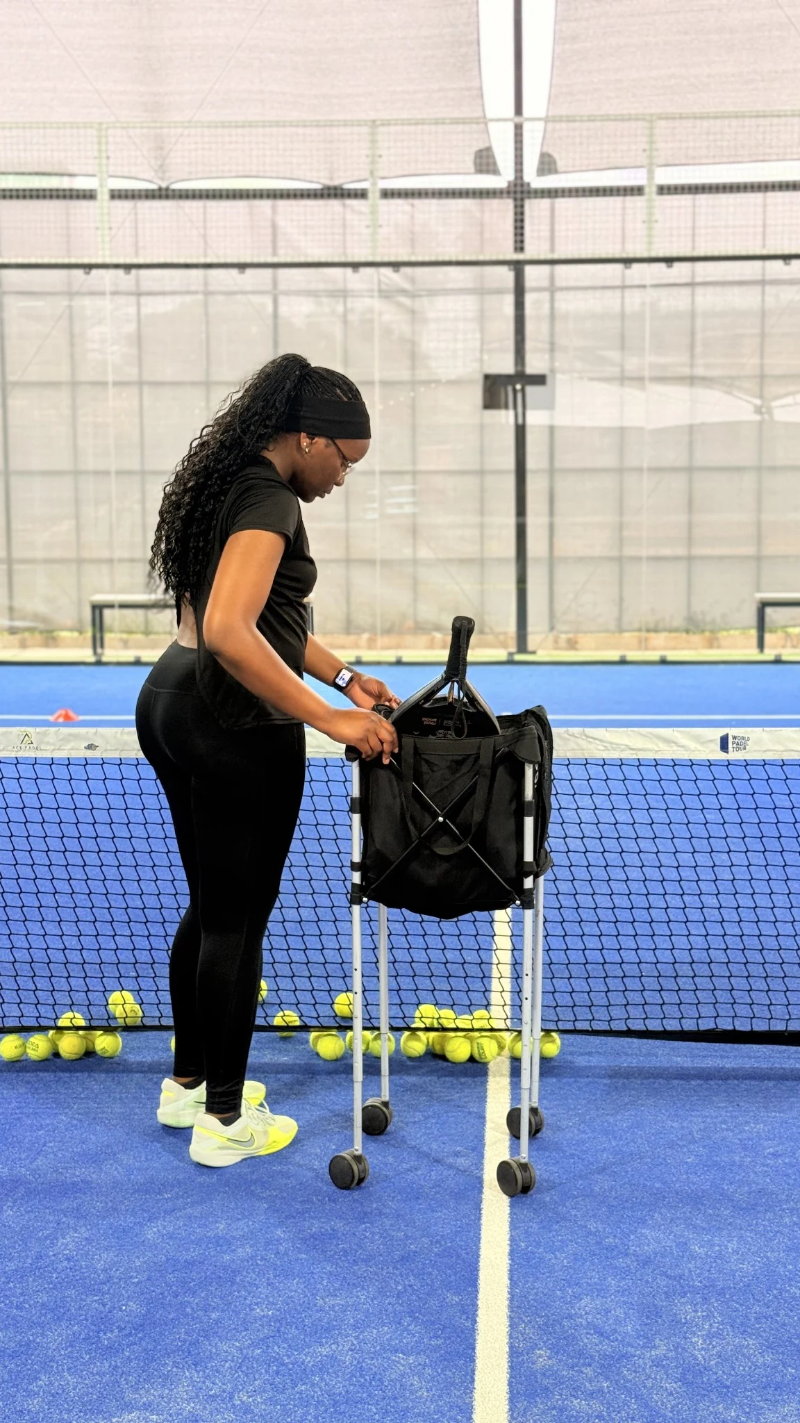 Tonia preparing balls for a padel practice session.