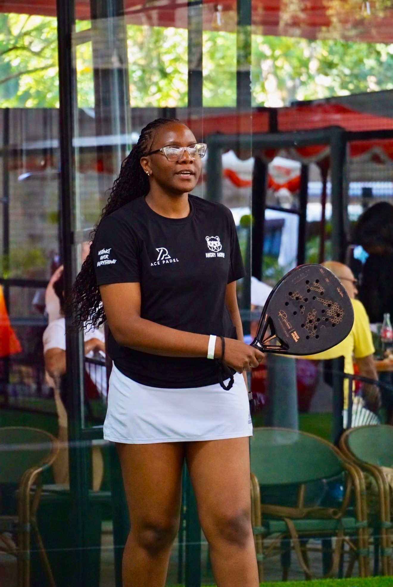 Tonia on court with her racket.
